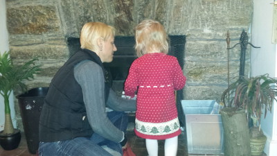 Summer teaches Hailey how to build a fire.