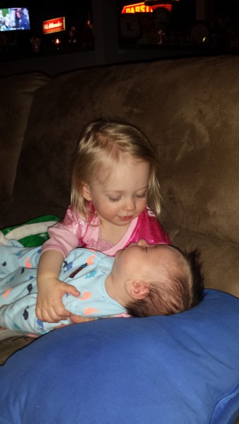 Practicing for her baby brother with Baby Lincoln