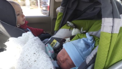 On the way home from the hospital.  Our new norm of two carseats (and that means two kids)!